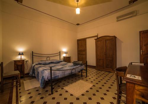 Postel nebo postele na pokoji v ubytování S'Apprigu B&B