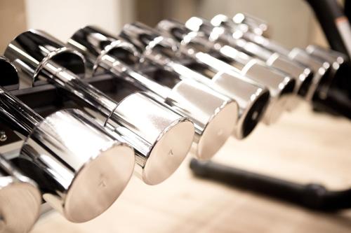 a row of chrome kitchen utensils in a row at Hotel San Lorenzo in Bormio