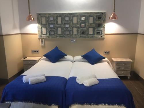 Ein Bett oder Betten in einem Zimmer der Unterkunft Hostal Boutique Luna de Gavín