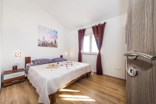 Posteľ alebo postele v izbe v ubytovaní Apartment Verunica