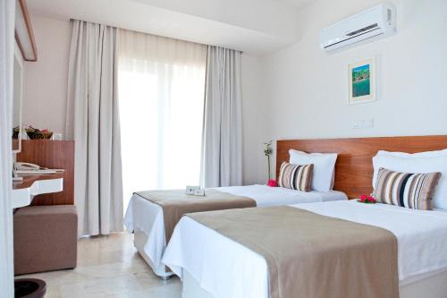 Кровать или кровати в номере Olea Nova Hotel