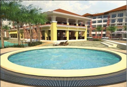 a large swimming pool in front of a building at 2 BR Sorrento Oasis in Manila