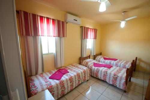 Postel nebo postele na pokoji v ubytování Pousada Jomar