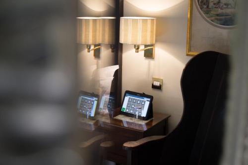 a hotel room with a desk with a clock on it at Luxury Escape in Hunstanton