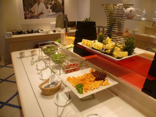 a buffet with appetizers on a counter in a restaurant at Infinito Hotel and Spa in Shirahama