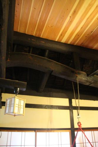 a ceiling of a building with a light hanging from it at Madarao Farm in Nakano