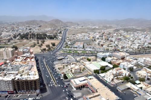 an aerial view of a city with a road at Awaliv Hotel in Taif