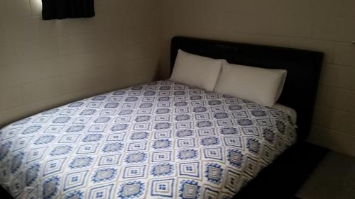 a bed with a bunch of dollar bills on it at Fairlie Holiday Park in Fairlie