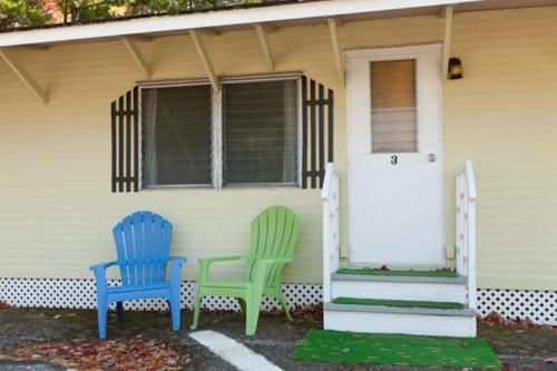 two chairs sitting on the porch of a house at Robbins Motel in Bar Harbor