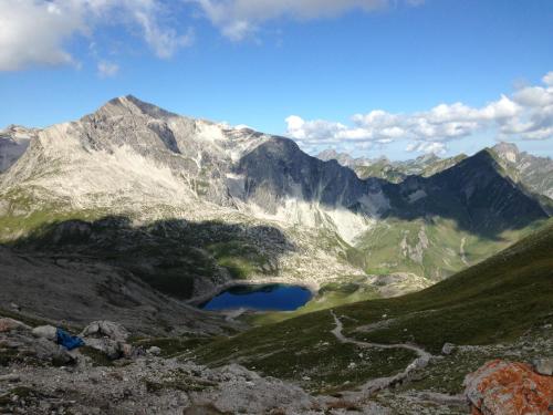 a view of a mountain range with a lake at Appartement Bettina in Schoppernau