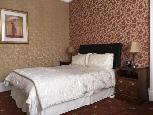 Ein Bett oder Betten in einem Zimmer der Unterkunft Abermar Guest House