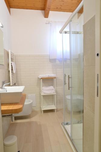 a bathroom with a glass shower and a sink at Villa Miriam in Gragnano