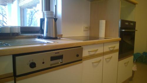 a kitchen with a microwave and a stove top oven at Jagdhaus Gerlos**** in Gerlos