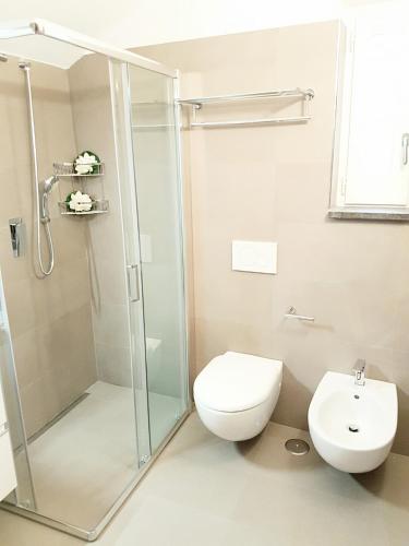 a bathroom with a shower and a toilet and a sink at Estate4home - Henry House in Sorrento