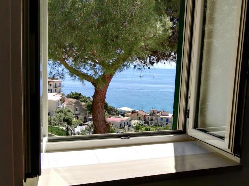 a window with a view of the ocean at Casa Vacanze Bouganvillea in Cetara
