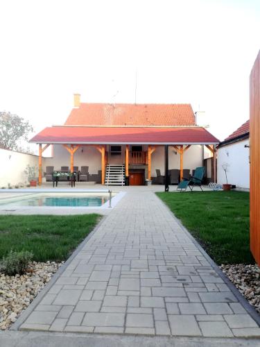 a house with a patio and a swimming pool at Ubytování u Kratochvílů in Dolní Dunajovice