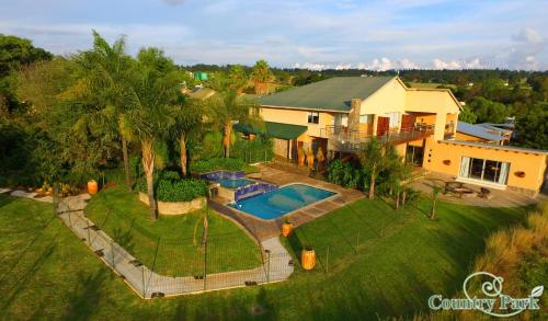 an aerial view of a house with a swimming pool at Country Park Guest House - Muldersdrift in Muldersdrift