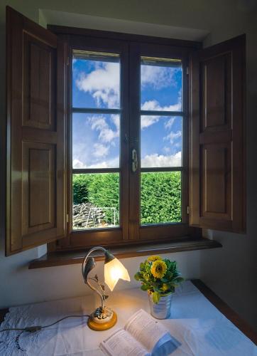 Postel nebo postele na pokoji v ubytování Agriturismo Ai Linchi