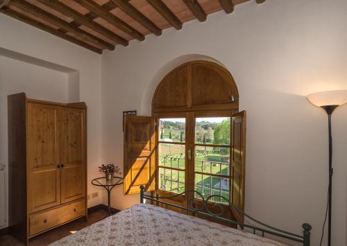 Postel nebo postele na pokoji v ubytování Agriturismo Ai Linchi