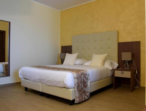 Postel nebo postele na pokoji v ubytování Hotel Residence Eden