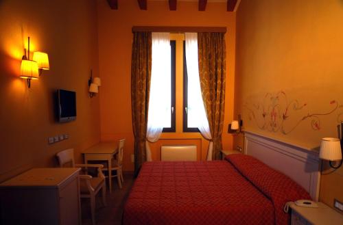 Hotel La Fornaceにあるベッド
