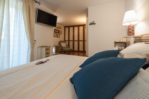 Katil atau katil-katil dalam bilik di Relais Serapo