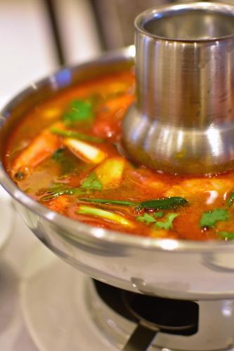 a pot of soup with a food processor at Siam Oriental Hotel in Hat Yai