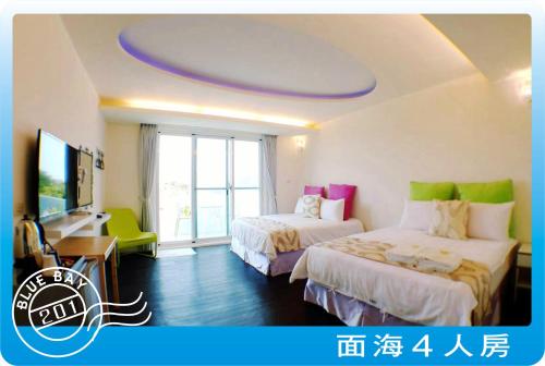 Postel nebo postele na pokoji v ubytování Kenting Blue Bay Inn