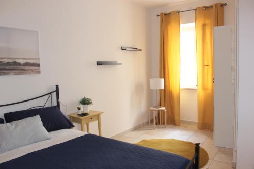 Ένα ή περισσότερα κρεβάτια σε δωμάτιο στο Le Mura Del Borgo