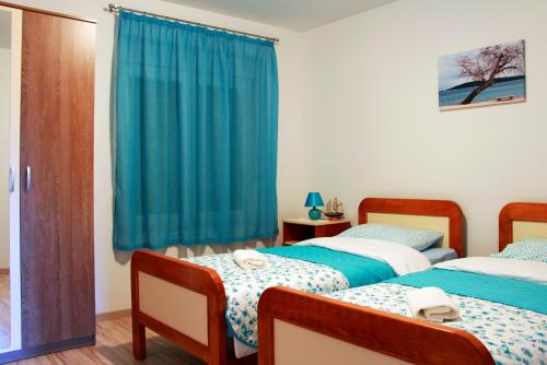 Postel nebo postele na pokoji v ubytování Apartment Ljubica Kaštel Gomilica