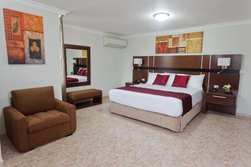 Postel nebo postele na pokoji v ubytování Hotel Coral Suites