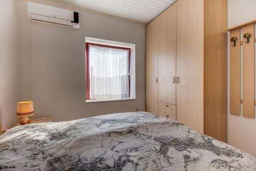Posteľ alebo postele v izbe v ubytovaní Apartman Haraciceva