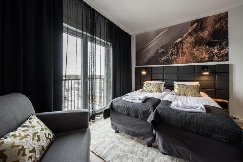 Ένα ή περισσότερα κρεβάτια σε δωμάτιο στο Forenom Aparthotel Kempele