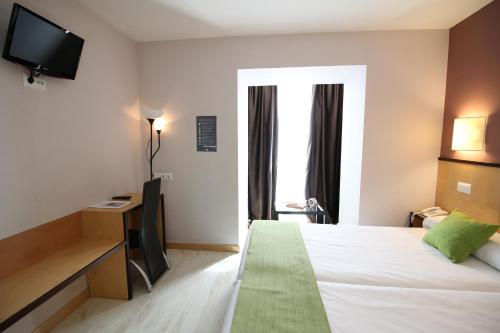 Postel nebo postele na pokoji v ubytování Hotel Alda Entrearcos