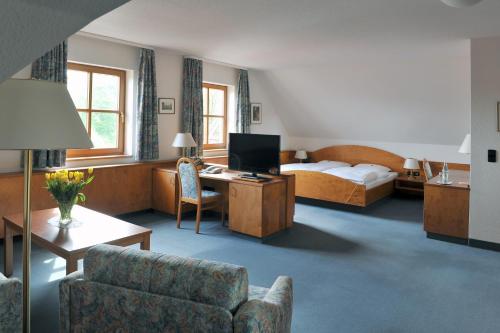 Postel nebo postele na pokoji v ubytování Hotel Grüner Baum