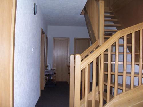 a staircase in a room with a stair case at Penzion Chanos in Stříbro