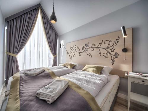 Posteľ alebo postele v izbe v ubytovaní VisitZakopane - Mountain Pass Apartment