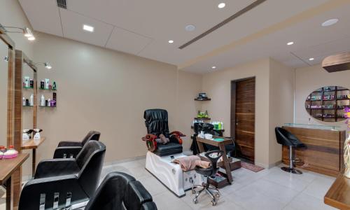 a salon with chairs and a barber shop at Iscon The Fern Resort & Spa, Bhavnagar in Bhavnagar