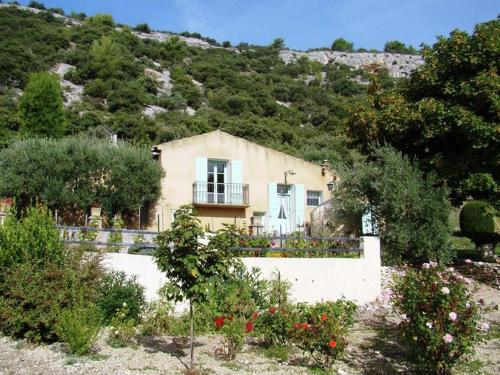 a house on the side of a mountain at Lovely Holiday Home in Saint Saturnin l s Apt with Pool in Saint-Saturnin-lès-Apt