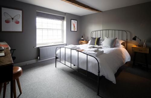 A bed or beds in a room at The Duke William 