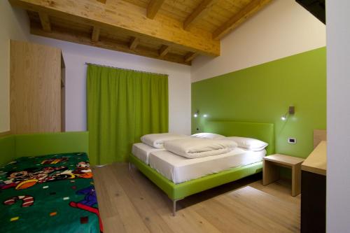 Voodi või voodid majutusasutuse Agritur I Colori toas