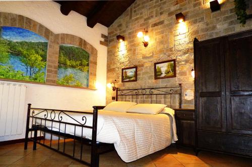 Ένα ή περισσότερα κρεβάτια σε δωμάτιο στο Chalet Sul Lago Hotel In Montagna