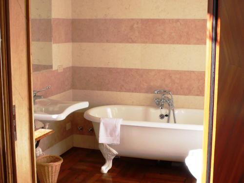 a bathroom with a tub and a sink at Imposing Castle in Northern Italy for Dreamy Royal Vacation in Monselice