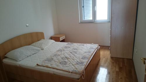 Кровать или кровати в номере Apartment Tija