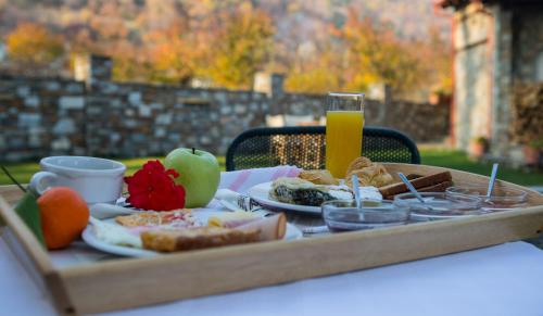 a table with a tray of food on a table at Evzin Hotel in Kato Loutraki