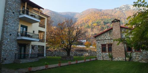 a house with a view of the mountains at Evzin Hotel in Kato Loutraki