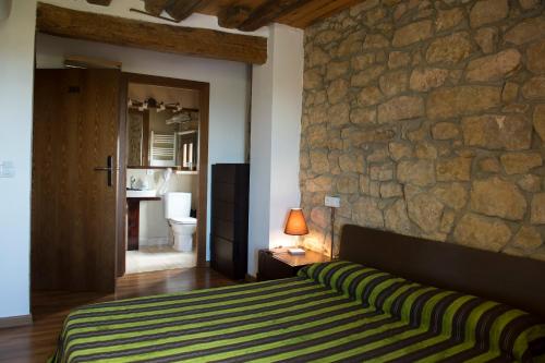 מיטה או מיטות בחדר ב-La Garbinada Hotel