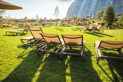 a group of lawn chairs sitting in the grass at Tropical Islands in Krausnick