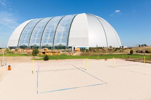 a large building with a large white dome at Tropical Islands in Krausnick