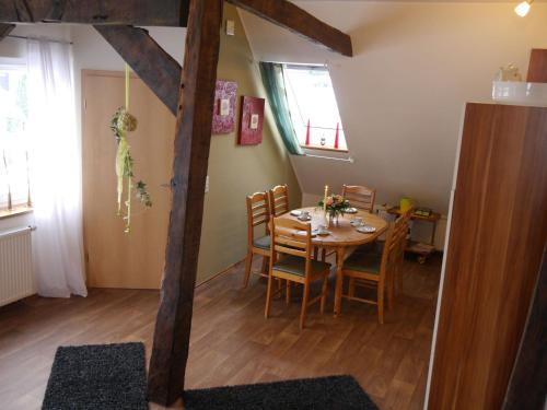 a dining room with a table and chairs at Beautiful holiday home with sauna in Schieder-Schwalenberg